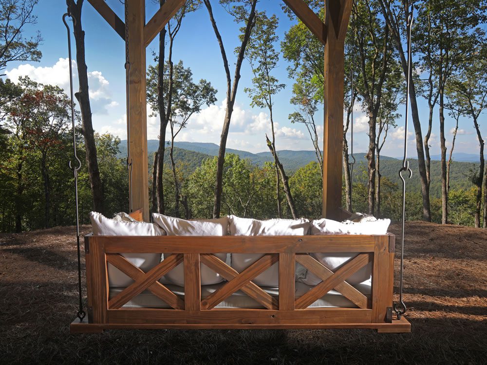 Outdoor bed swing for a mountain home